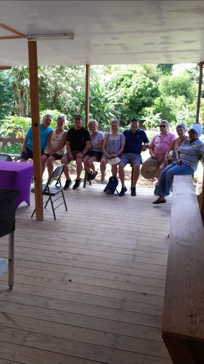Theresa seated with guests visiting the farm