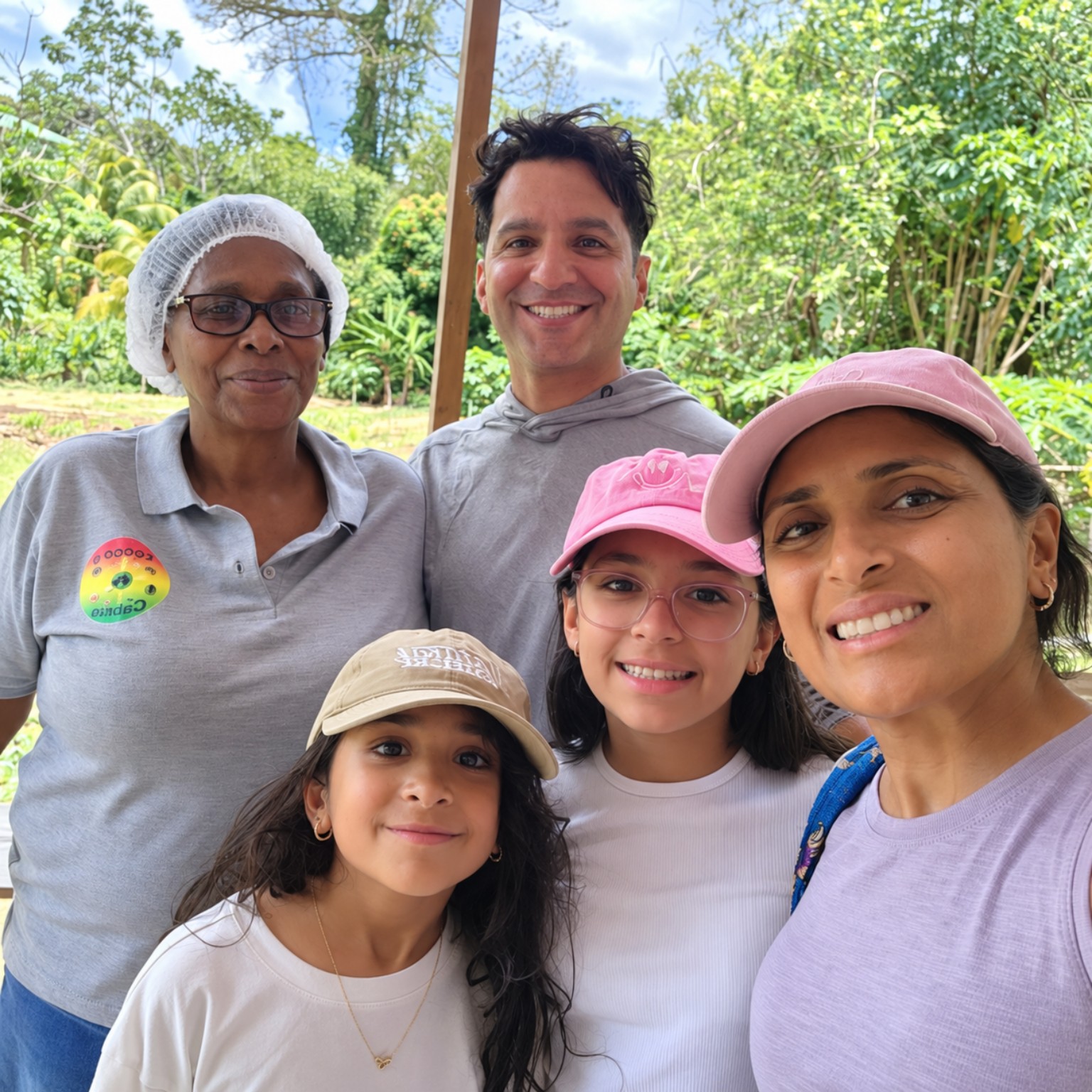 Theresa with a family of four visitors enjoying their time at the farm